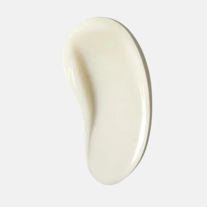Creamy skincare product swatch on white background, moisturizing lotion texture