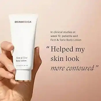 SkinMedica Firm & Tone Body Lotion held in hand against a soft pink background.
