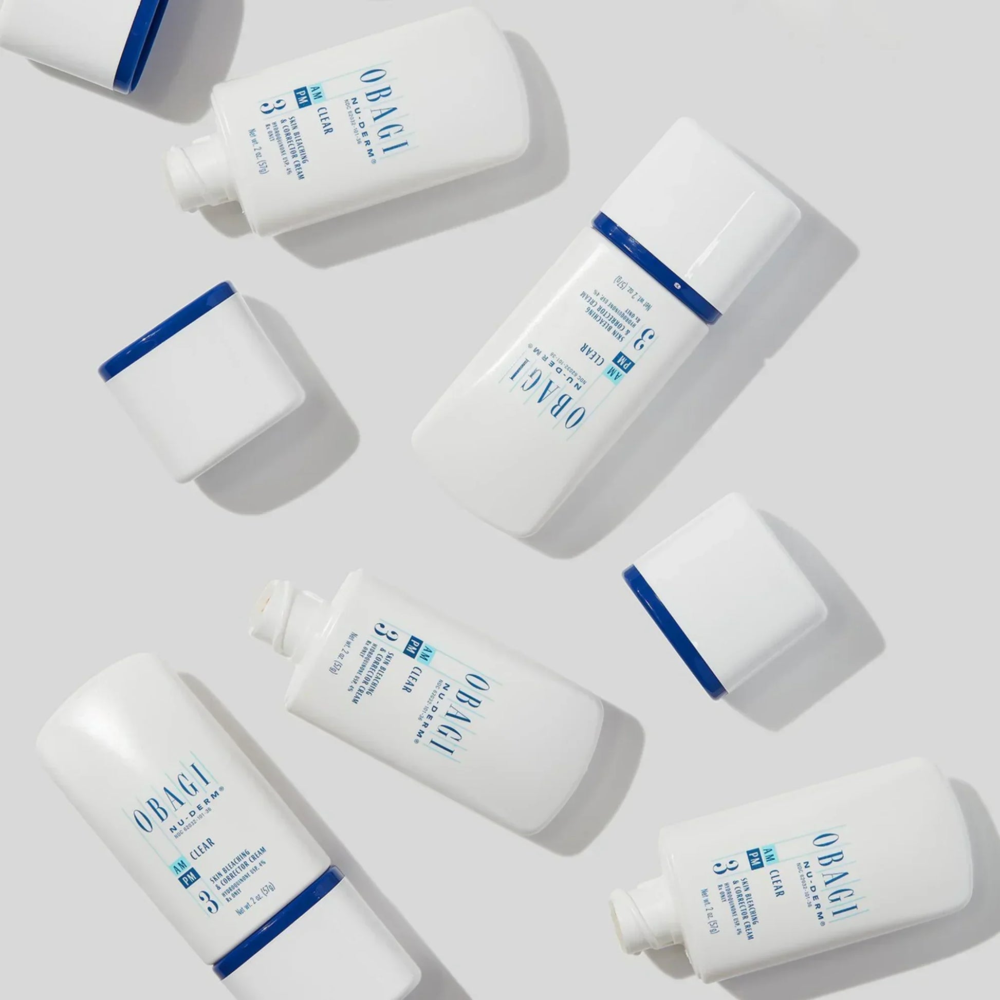 Obagi Nu-Derm Clear FX skincare bottles arranged on a light background