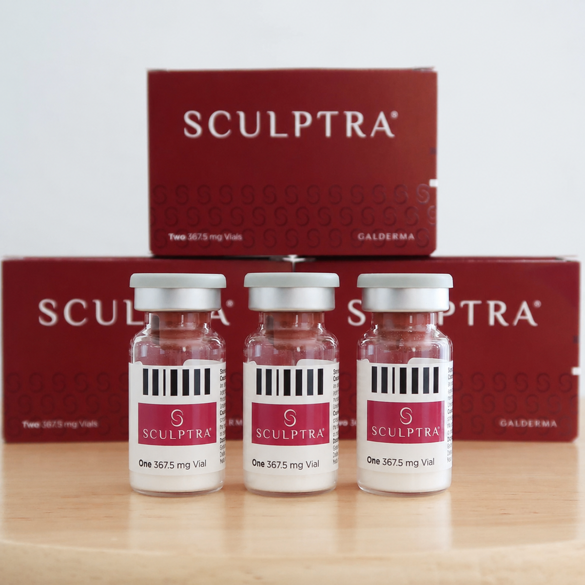Three vials of Sculptra 367.5 mg injectable dermal filler with red product packaging.