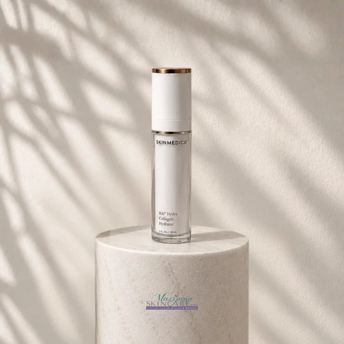 SkinMedica HA Hydra Collagen Hydrator serum bottle on a white marble pedestal