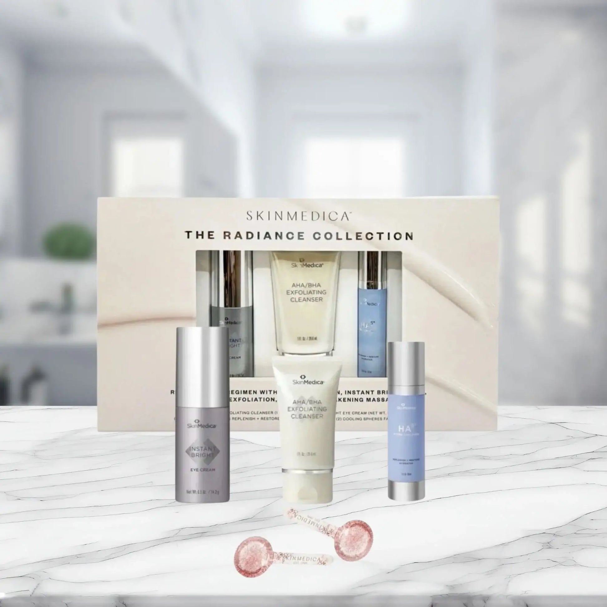 SkinMedica The Radiance Collection skincare set with exfoliating cleanser, eye cream, and HA serum on marble
