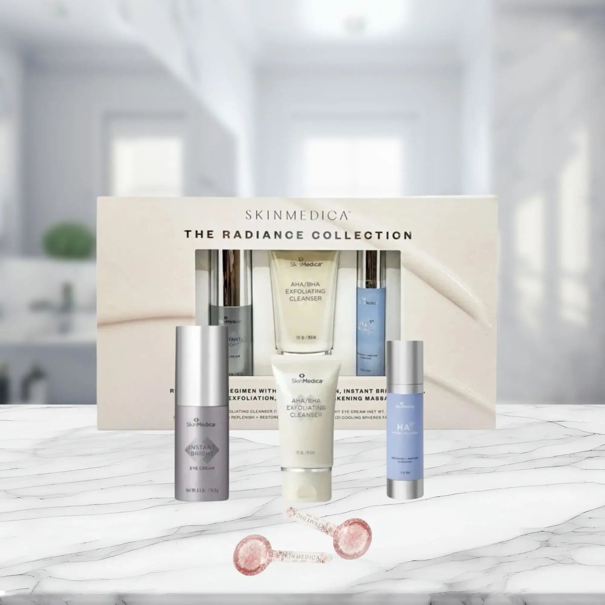 SkinMedica The Radiance Collection skincare set with exfoliating cleanser, eye cream, and HA serum on marble