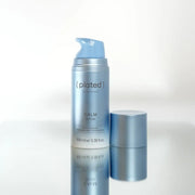 Plated Skin Science Calm Serum with Renewosome technology, 100ml bottle on reflective surface