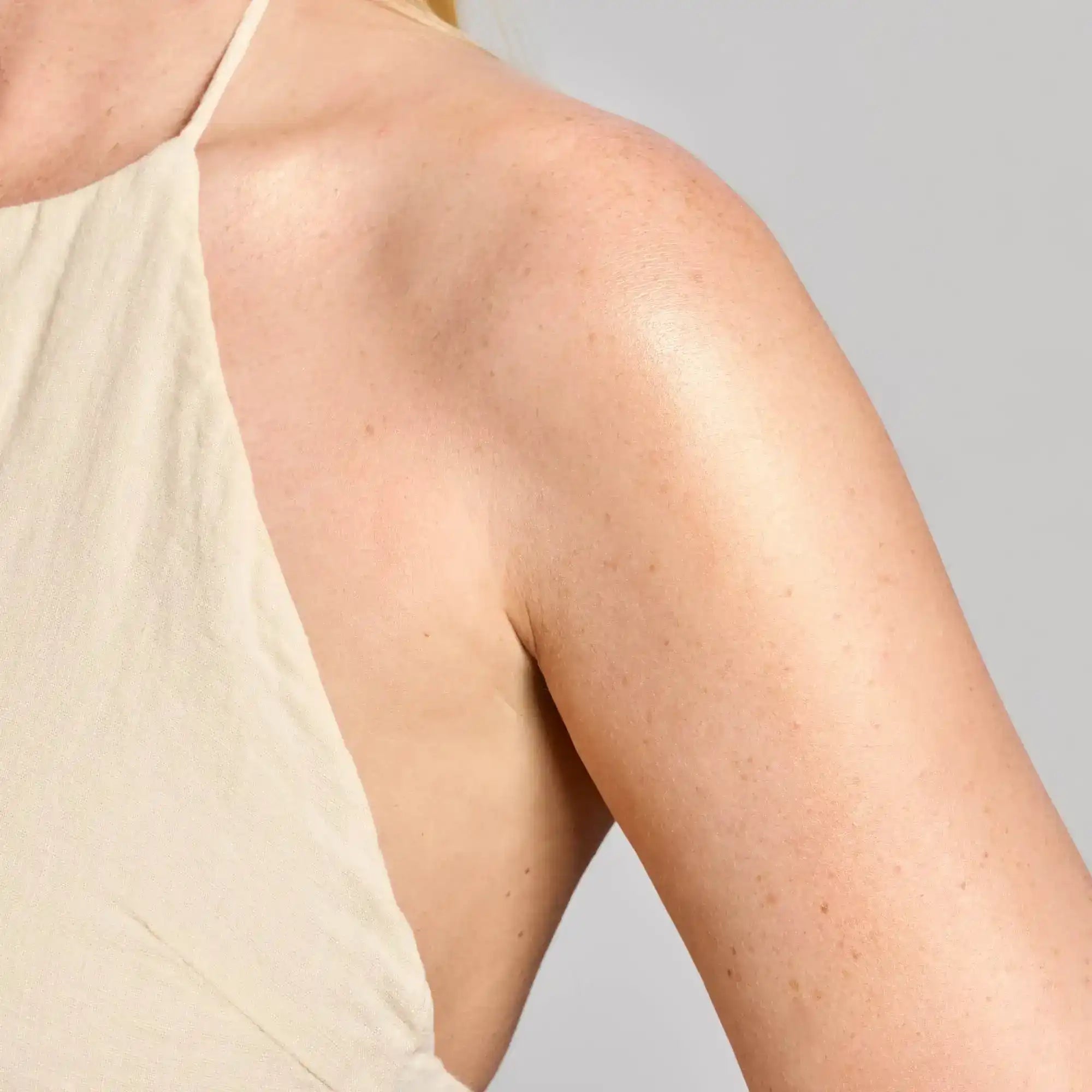 Smooth, glowing skin on shoulder and arm, showcasing healthy skincare results