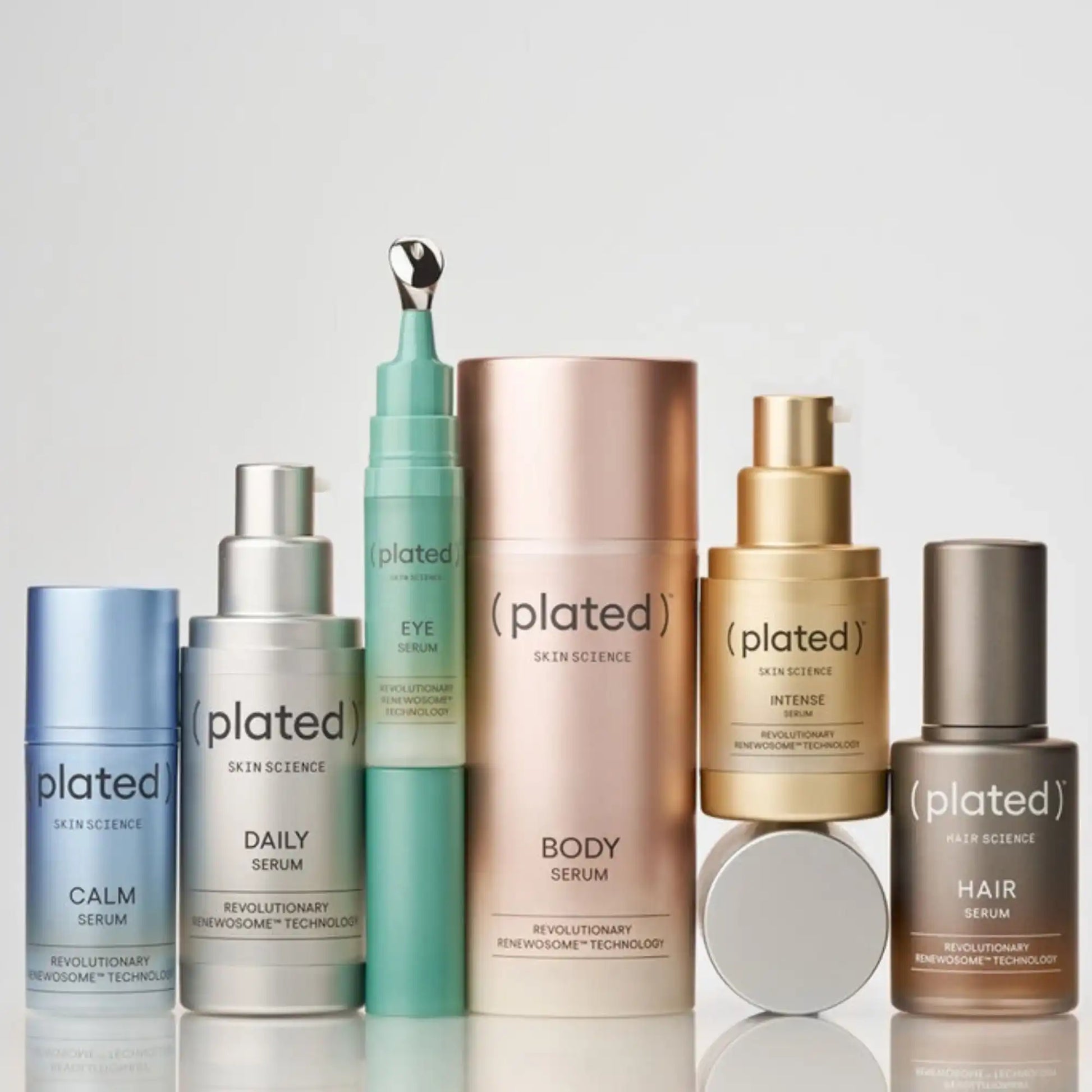 Plated Skin Science serums collection featuring Calm, Daily, Eye, Body, Intense, and Hair Serums with Renewosome technology