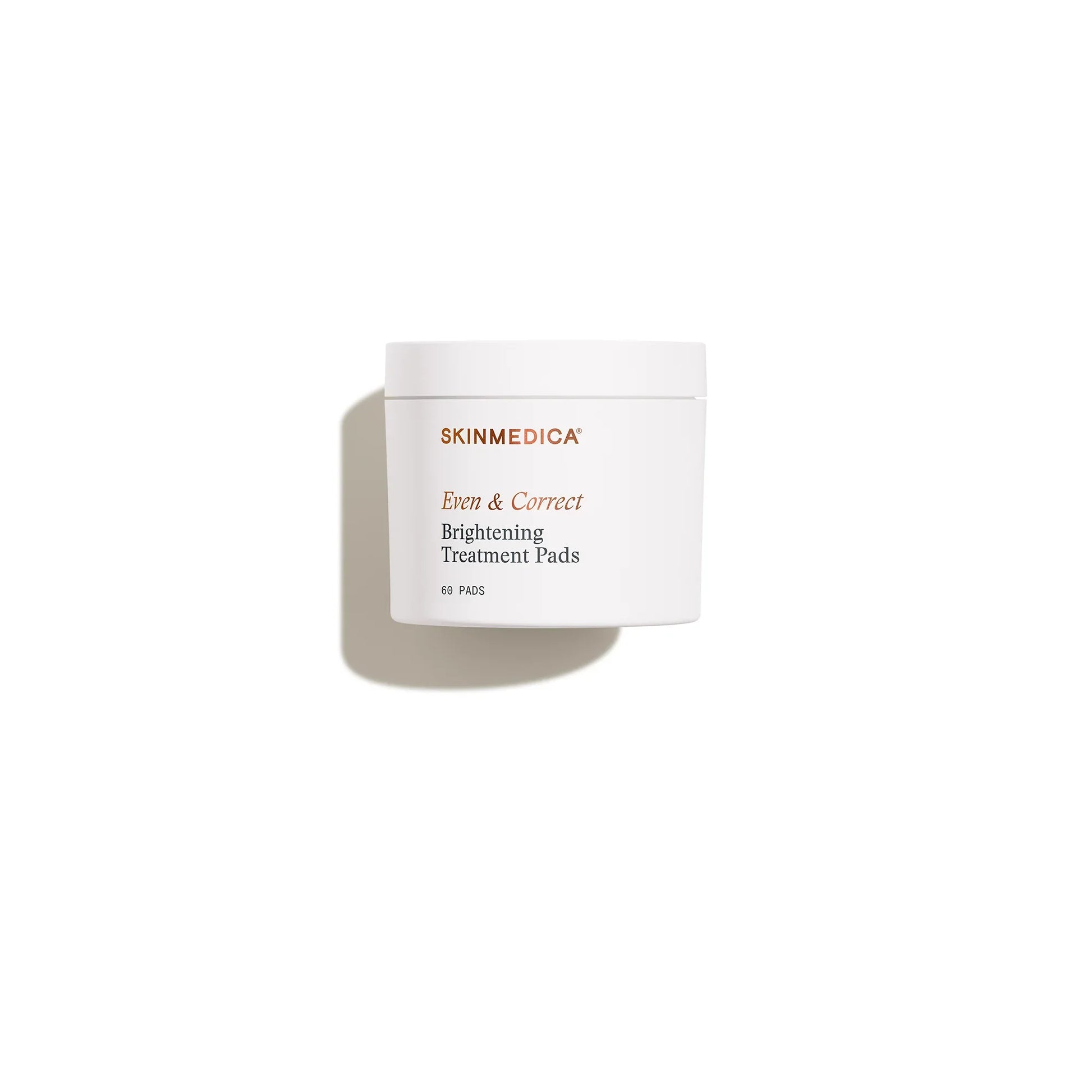 White jar labeled 'Even & Correct Brightening Treatment Pads' for skin care, isolated on white background.