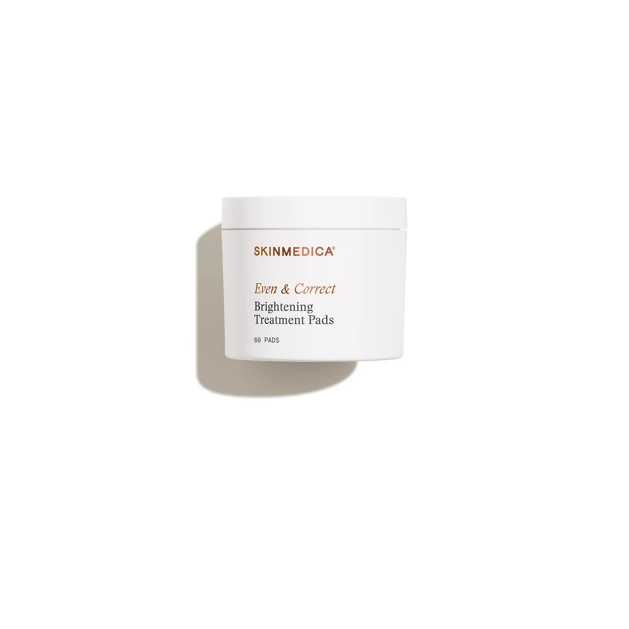 White jar of Even & Correct Brightening Treatment Pads for skincare, shadow on white background